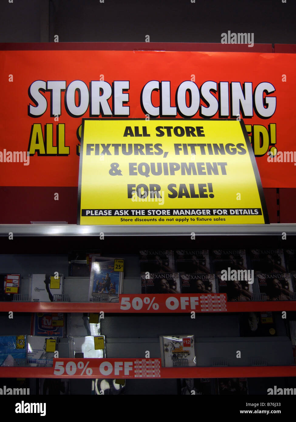 STORE CLOSING / Fixtures & Fittings for sale - signs in a store closing sale due to Liquidation. (Woolworths) Stock Photo