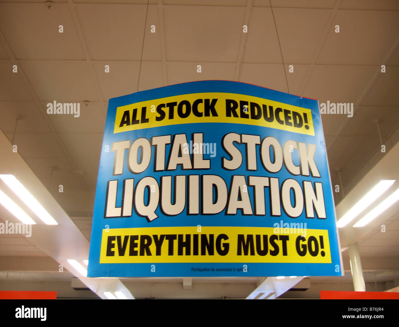 TOTAL STOCK LIQUIDATION signs in a store closing sale due to