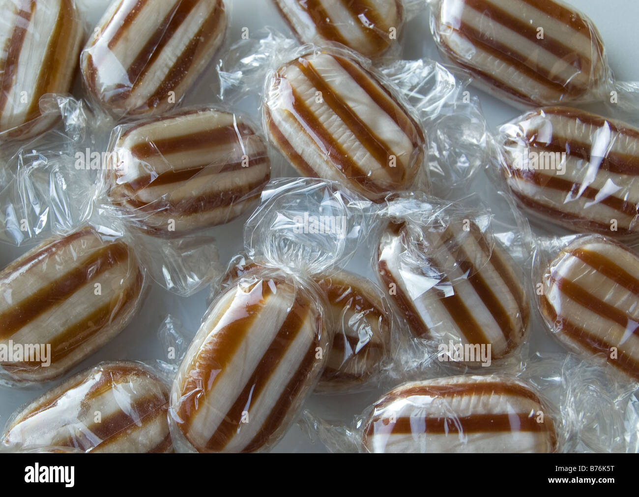 Humbug mint sweets in shiny wrappers Stock Photo