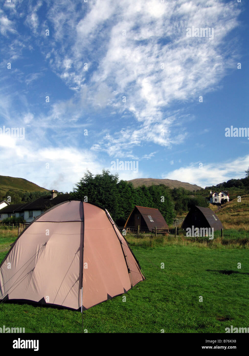 Camping Tents and Wooden Wigwams at Tyndrum in the Scottish Highlands Stock Photo