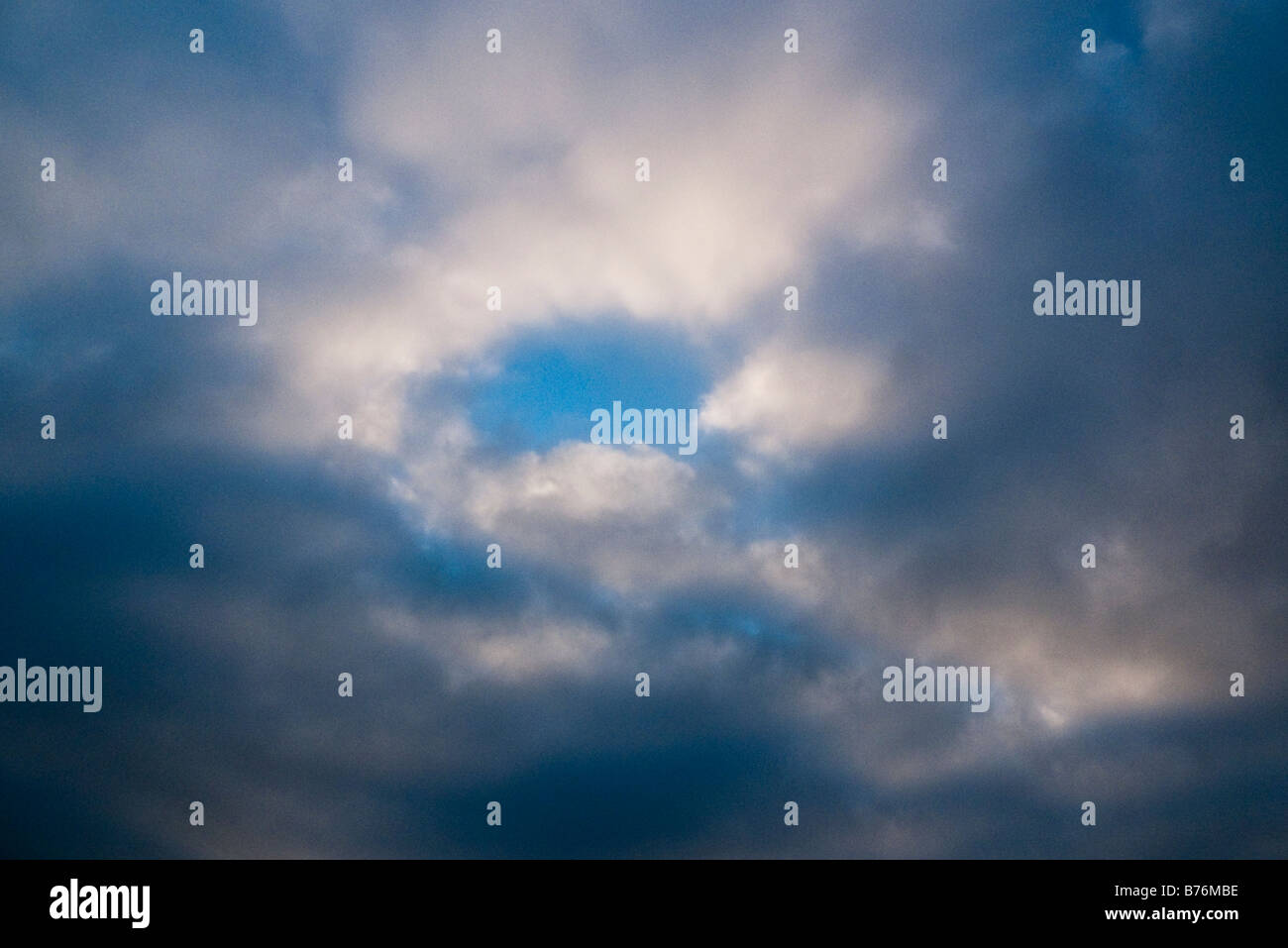 Blue sky gaps in the cloud Stock Photo