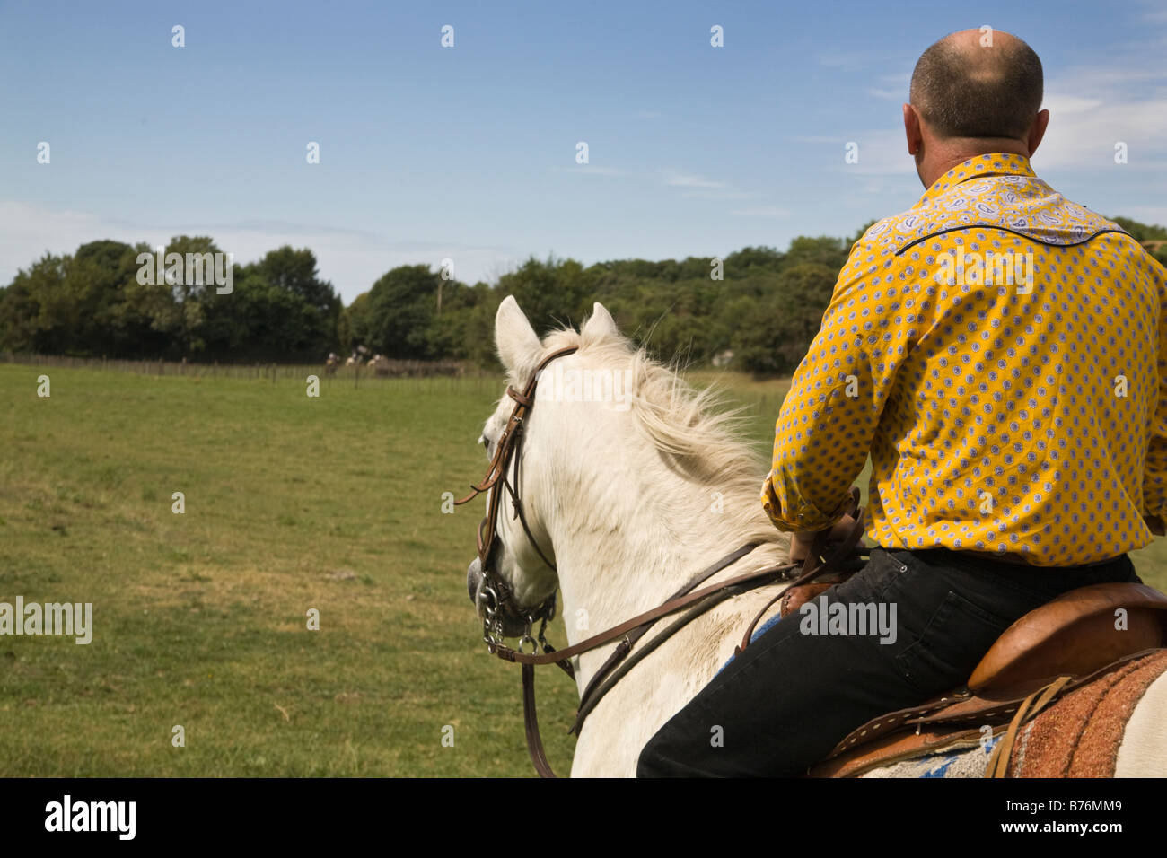 Gardian on Camargue pony, France Stock Photo