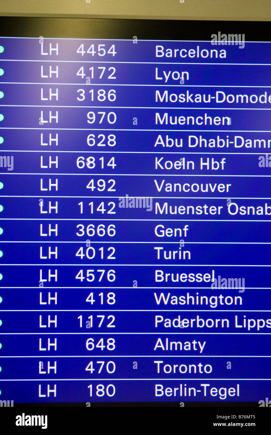 Airport flight schedule screen showing list of international destinations with flight numbers Frankfurt Airport Germany Stock Photo