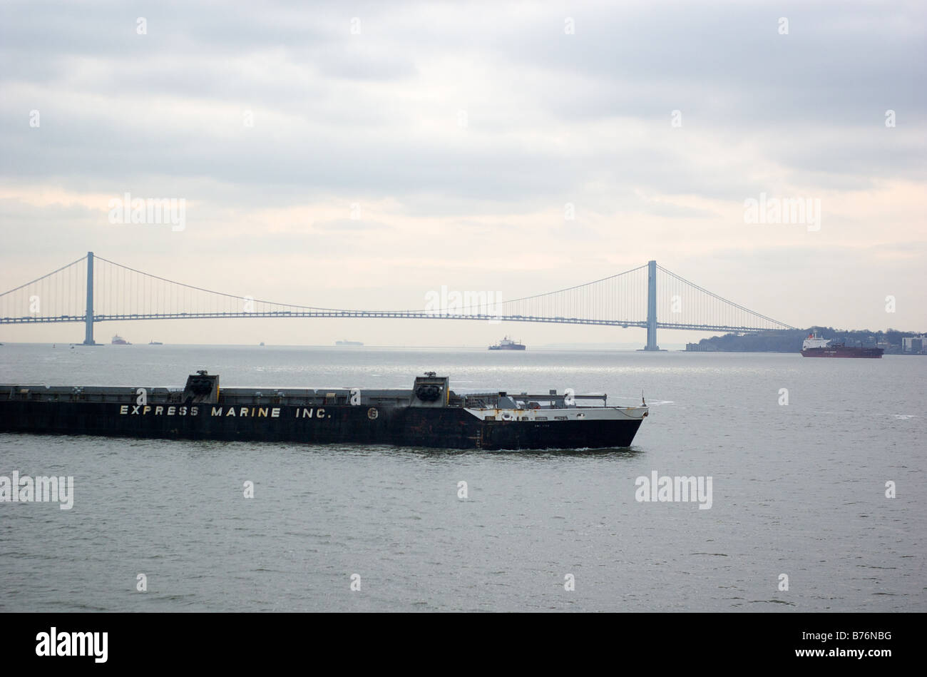 Verrazano Narrows Bridge and Express Marine Barge in Upper New York Bay USA (For Editorial Use Only) Stock Photo