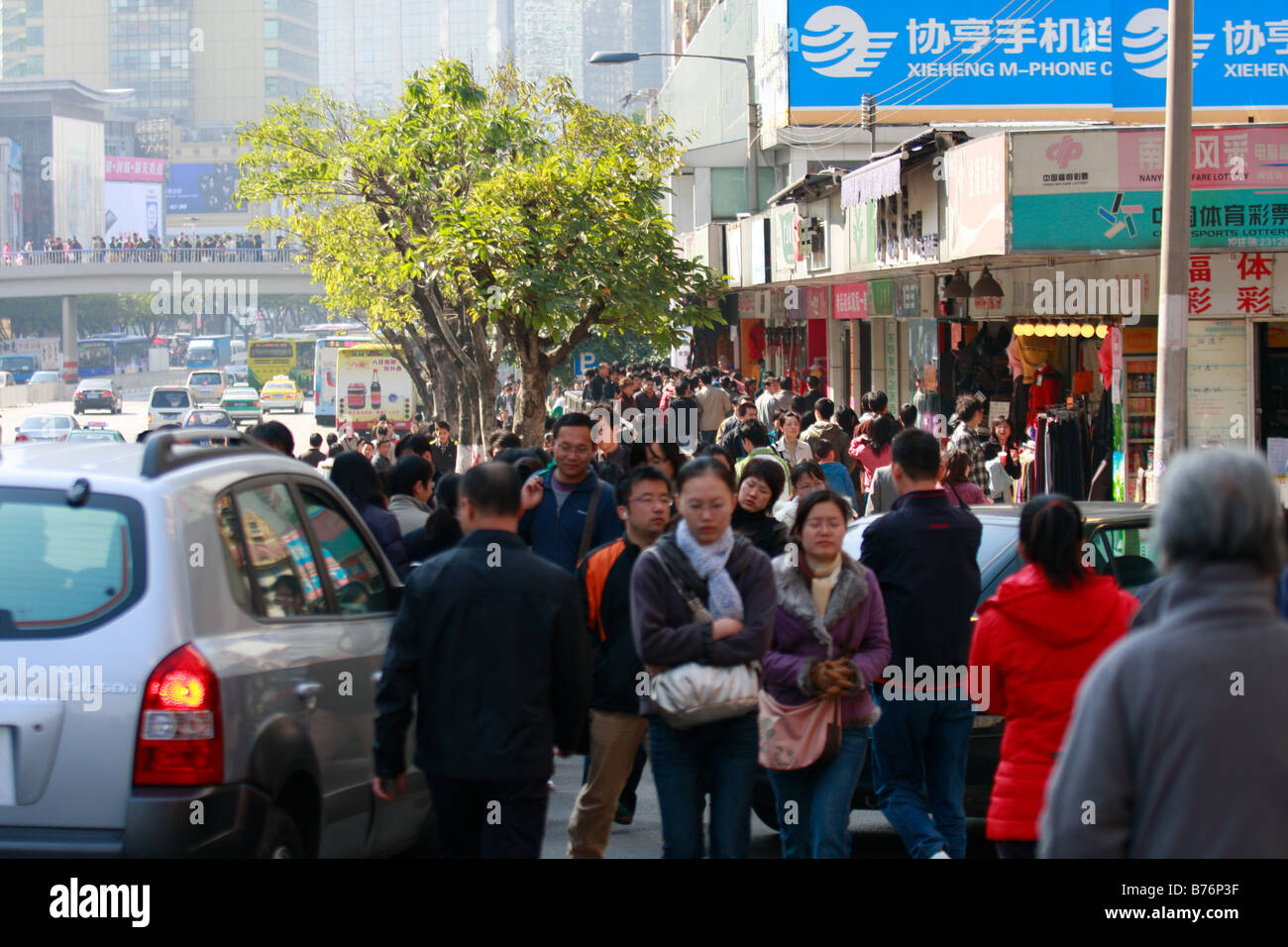 Crowds of Chinese Shoppers green tree Stock Photo