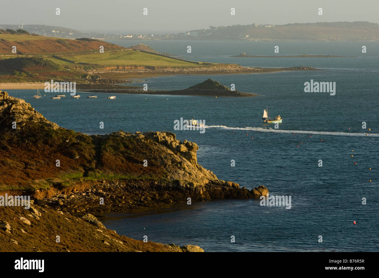 New Grimsby harbour quay on Tresco with St Mary's island in the