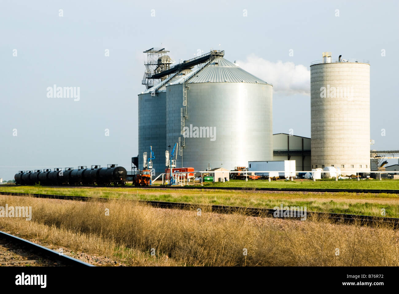 an ethanol plant in South Dakota with rail cars in the foreground Stock