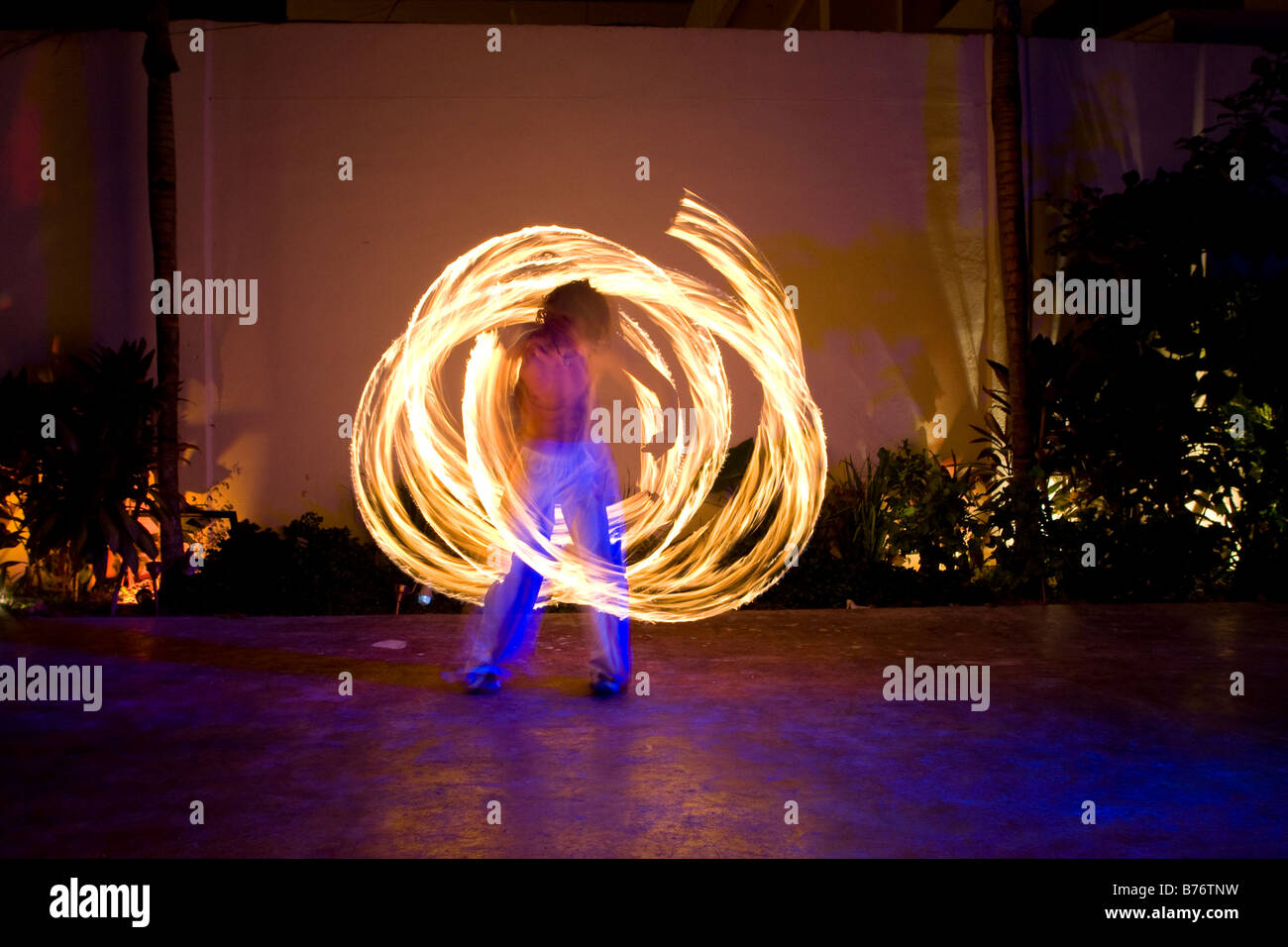 Fire Dancers putting on a show at night in Playa Del Carmen Mexico Stock Photo