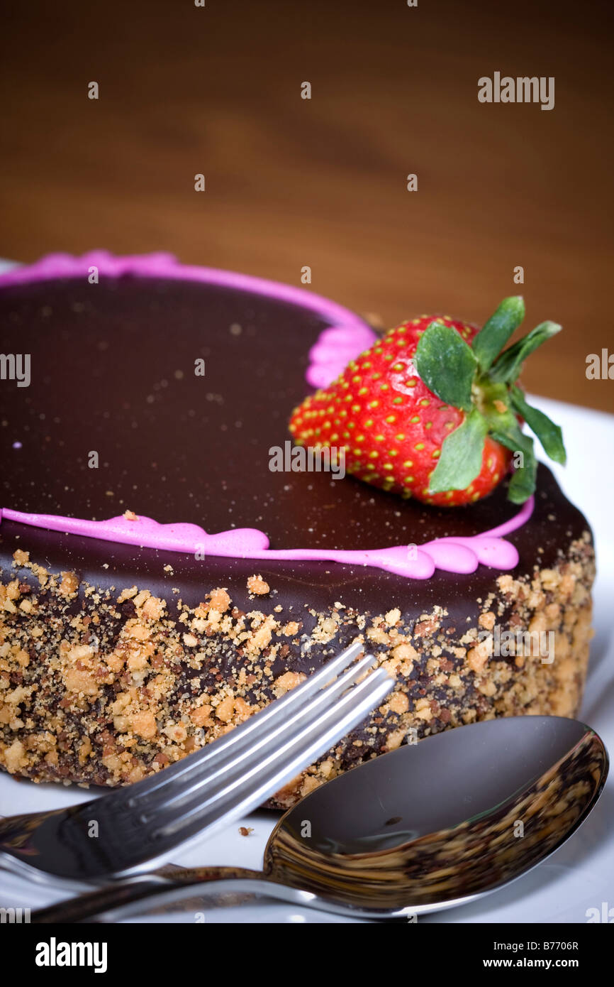Chocolate cake with strawberry on a plate Stock Photo