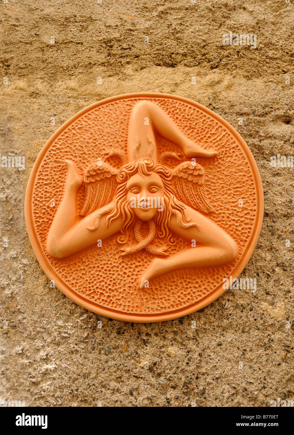 Trinakria or 3 legged woman with her head surrounded by snakes which is