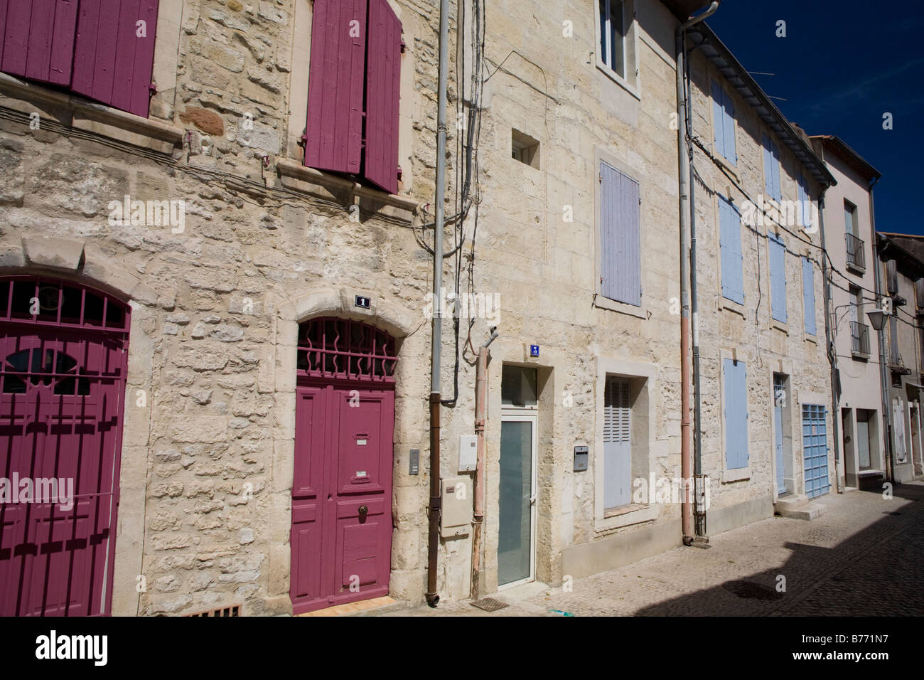 Old stony houses with colorful shutters facade in Tarascon, Bouche du