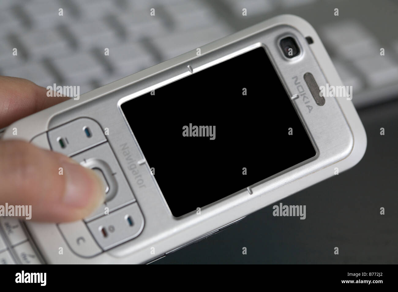 Nokia 6110 Navigator with keyboard in the background Stock Photo - Alamy