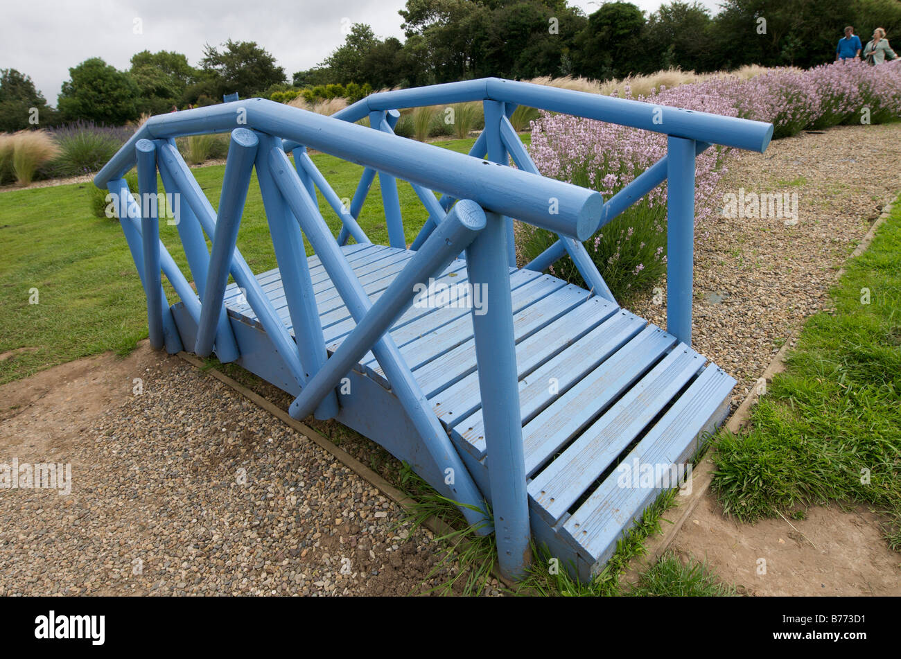 Pretty arched blue garden bridge Stock Photo