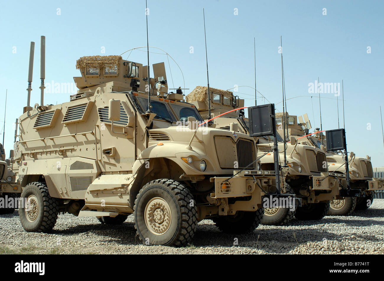 Mine Resistant Ambush Protected vehicles sit in the parking area at Joint Base Balad, Iraq. Stock Photo