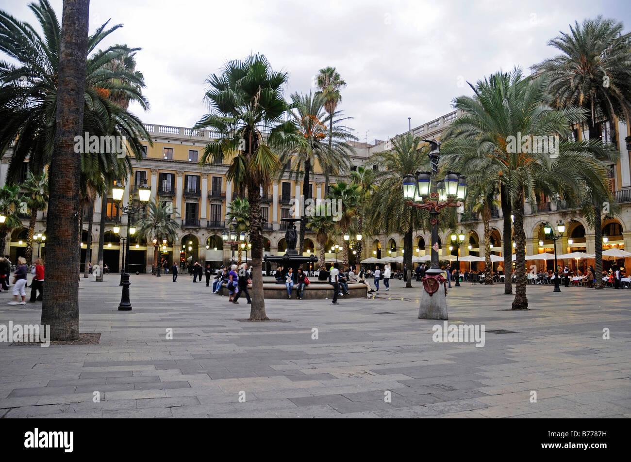 Placa Reial Square, people, palm trees, dusk, evening, Barcelona, Catalonia, Spain, Europe Stock Photo
