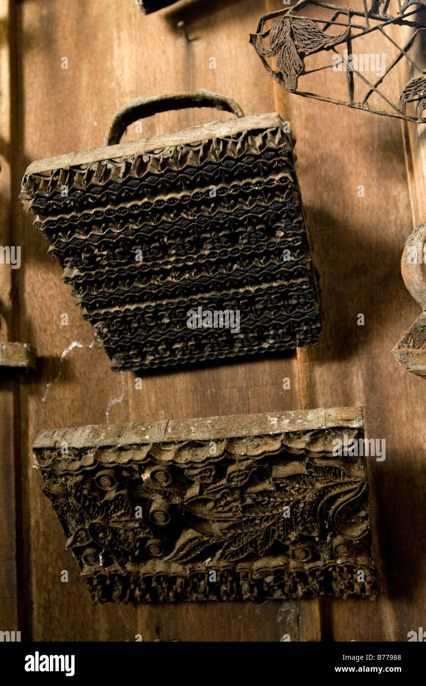 Traditional batik pressing blocks in Terengganu Malaysia. Batik pressing blocks are dipped into liquid wax. Stock Photo