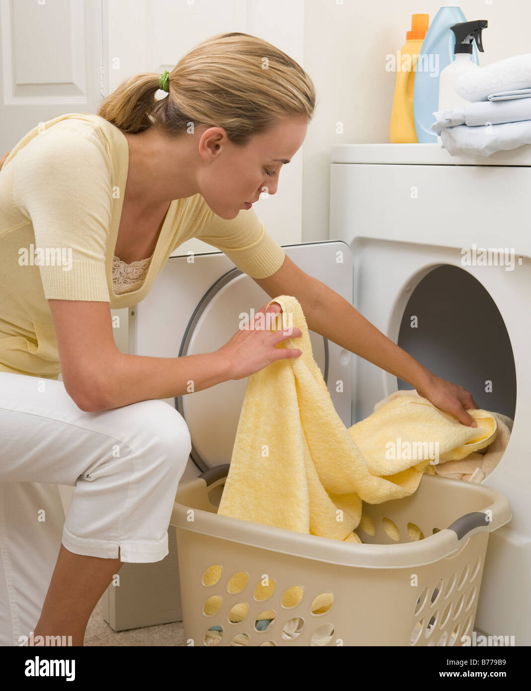 Removing clothes from a dryer hires stock photography and images Alamy