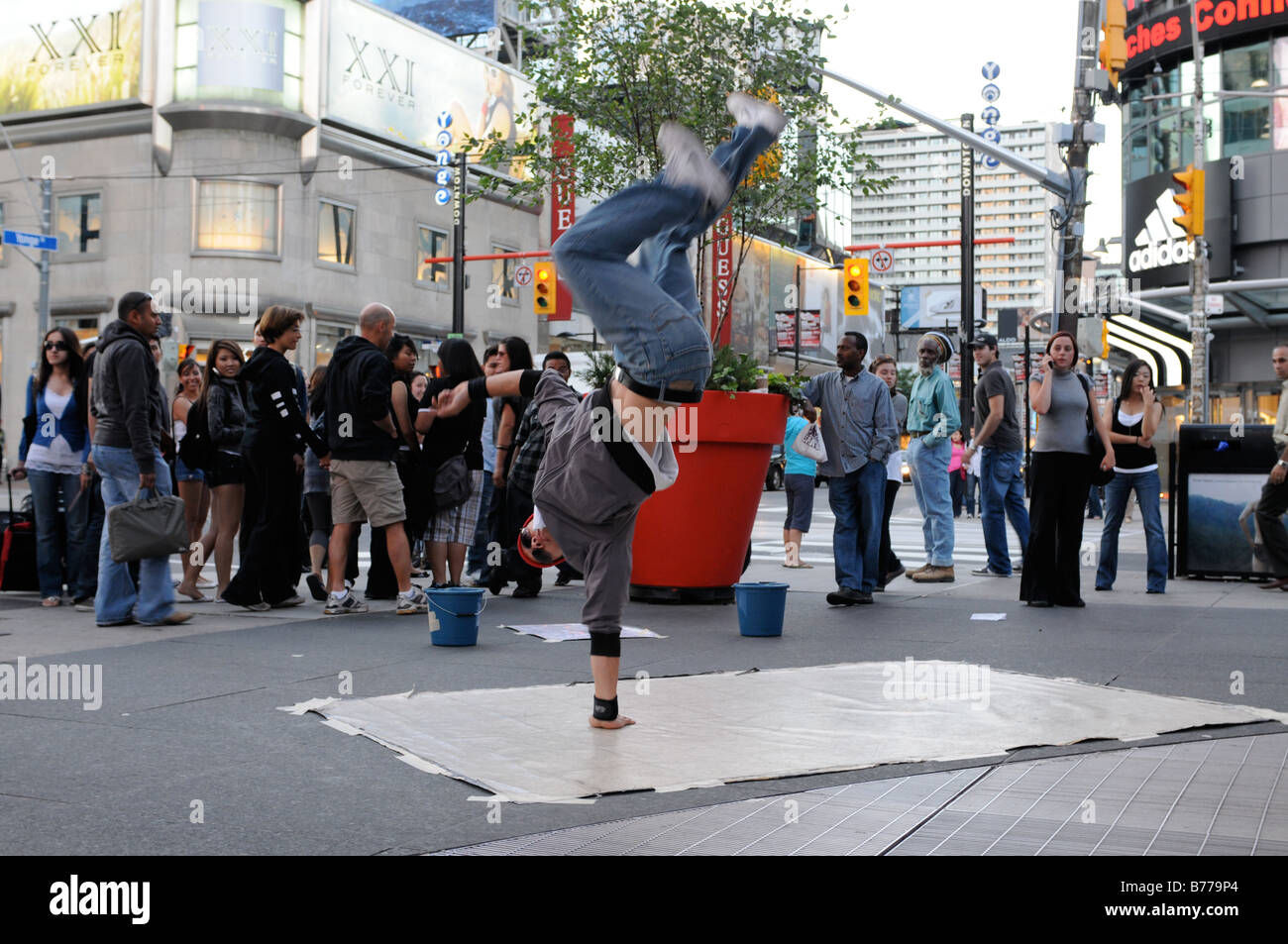 A talented street dancer entertains people at Yonge Dundas Square, in Toronto, Ontario, Canada Stock Photo