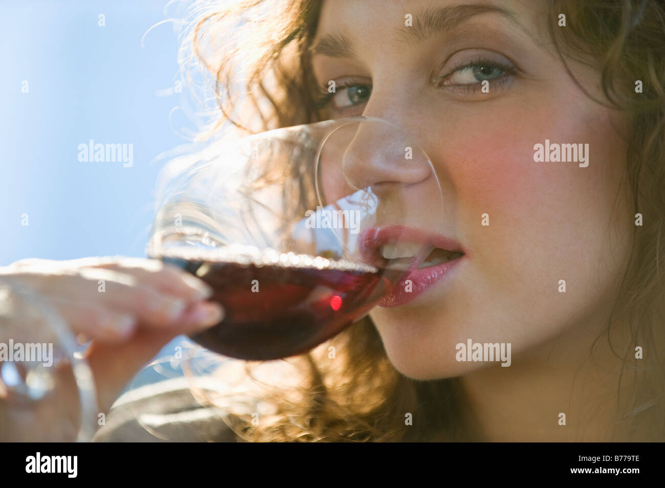 Close up portrait of woman drinking red wine Stock Photo