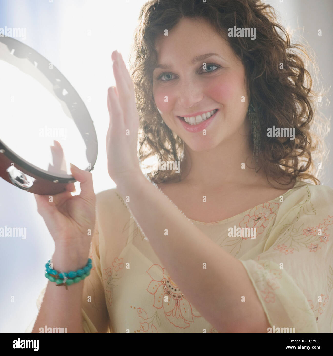 Playing tambourine hires stock photography and images Alamy