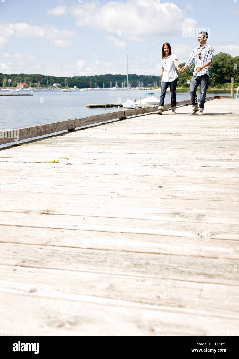 Couple walking holding hands hi-res stock photography and images - Alamy