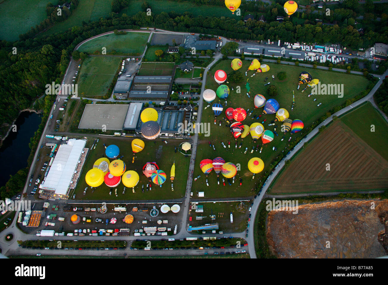 Aerial photograph, hot-air ballons, International Mogolfiade, start at the Warsteiner Brewery, sunset, Hirschberg, Warstein, Sa Stock Photo