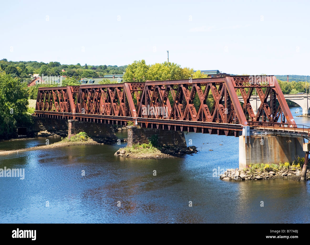 Steel railroad bridge spanning river, Connecticut Stock Photo