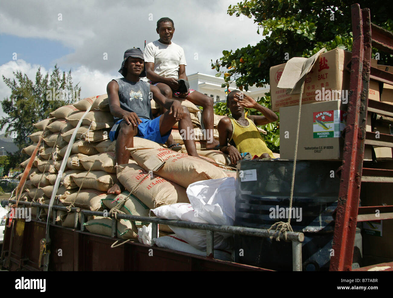 Sacks of sugar, workmen on a lorry, Beau plan, Port Louis, Mauritius ...