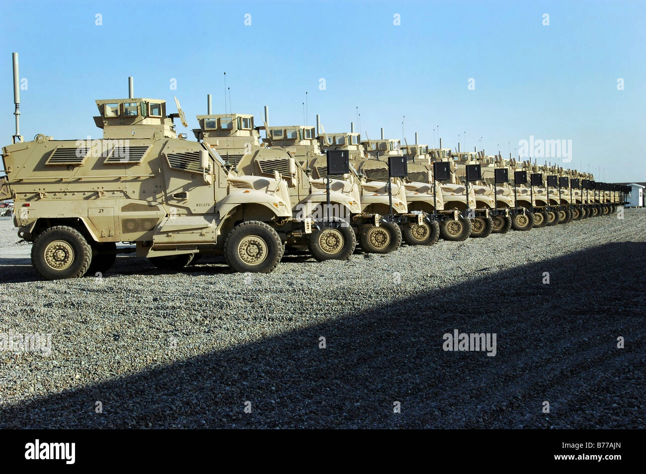 Mine Resistant Ambush Protected vehicles sit at Camp Liberty. Stock Photo