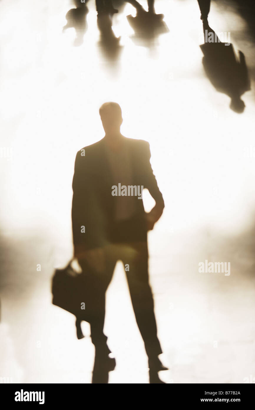 Silhouette of businessman holding briefcase Stock Photo - Alamy