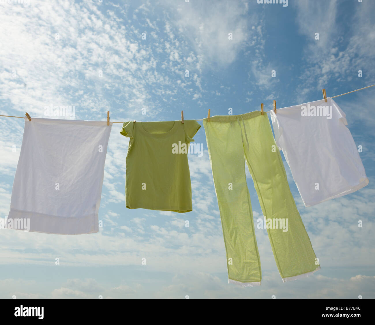Clothes hanging from clothesline Stock Photo - Alamy