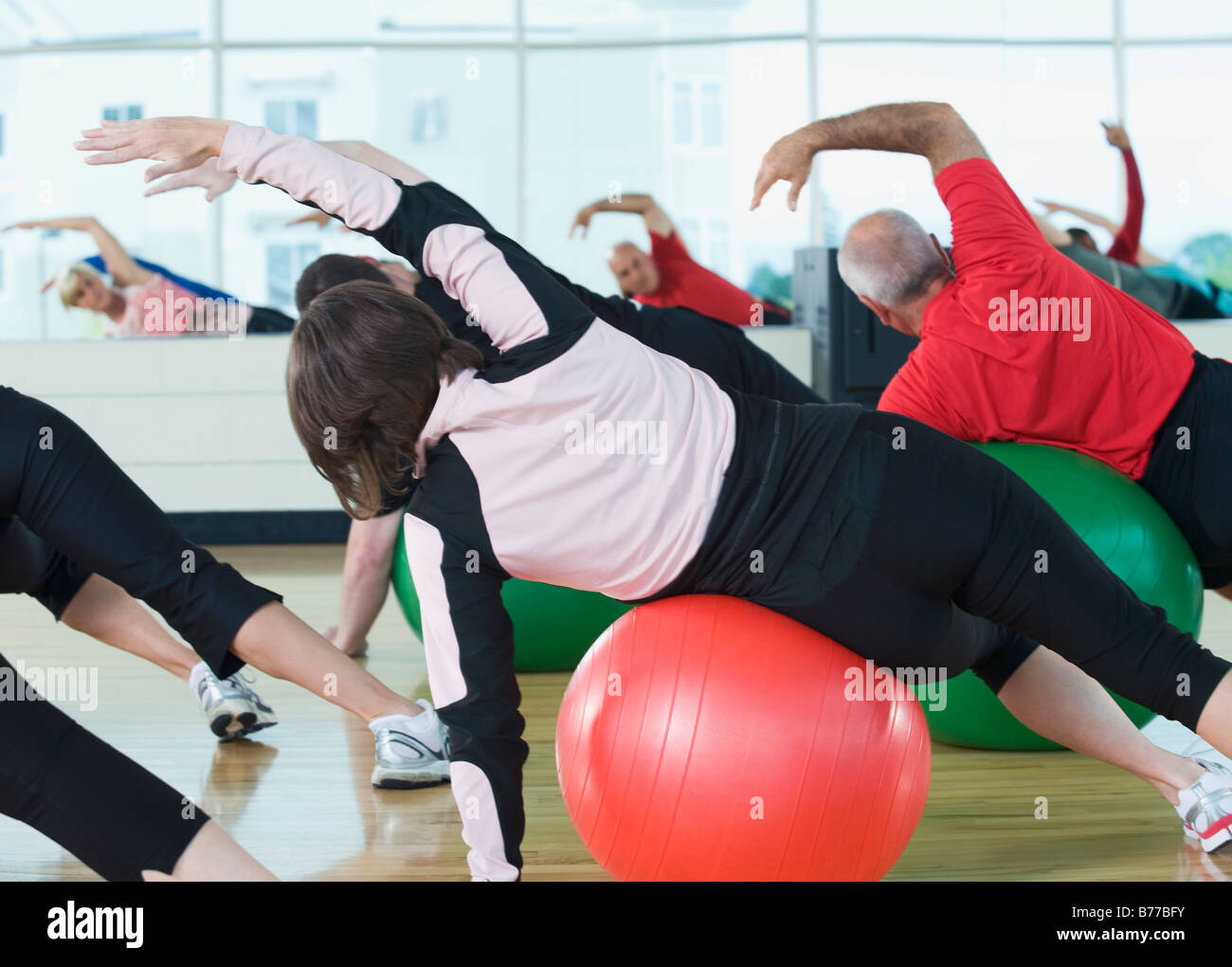 Fitness class stretching on balance balls Stock Photo