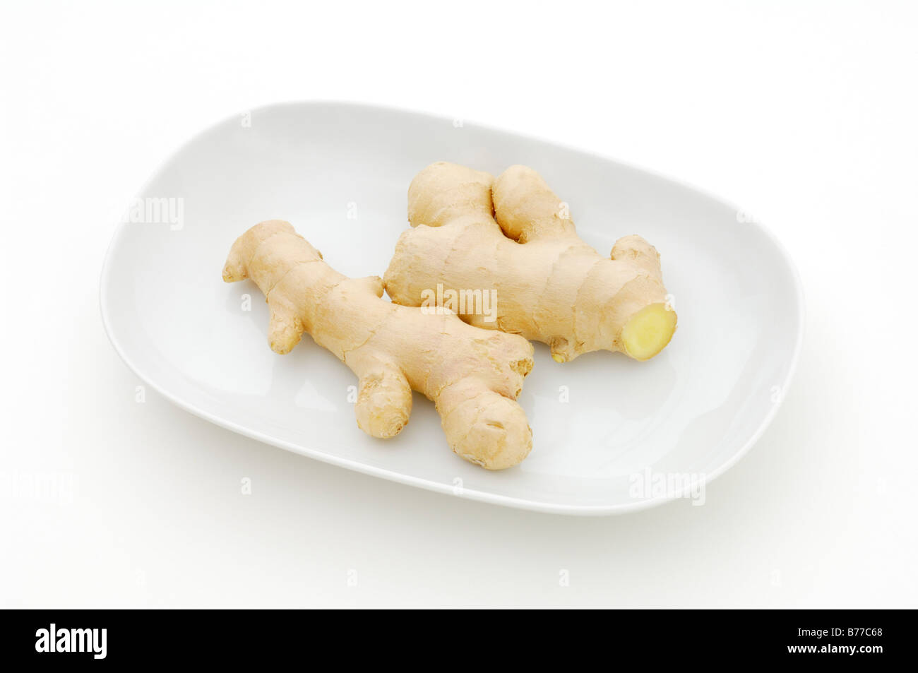 Ginger rhizome (Zingiberaceae) on a plate Stock Photo
