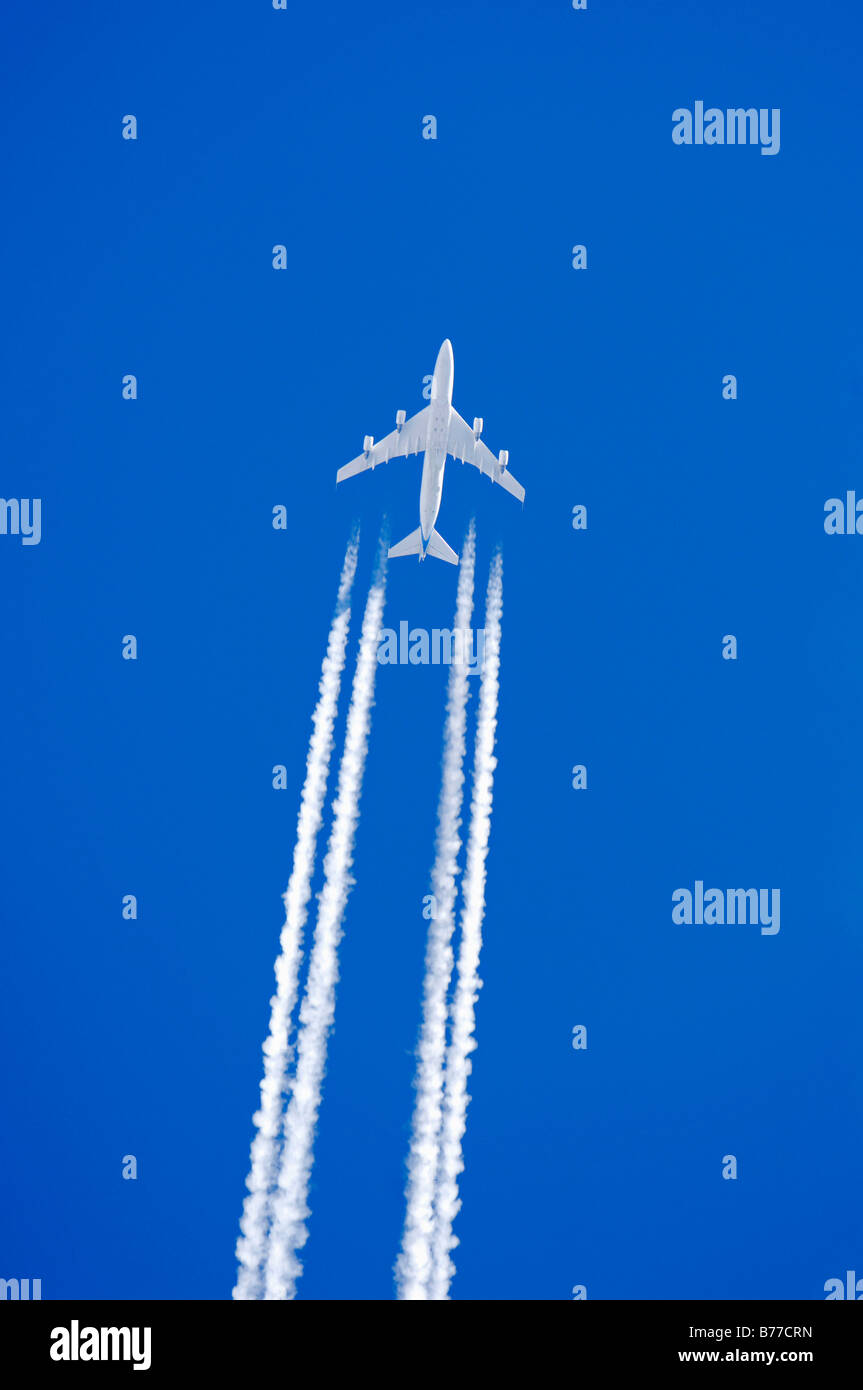 Aeroplane with condensation trail Stock Photo