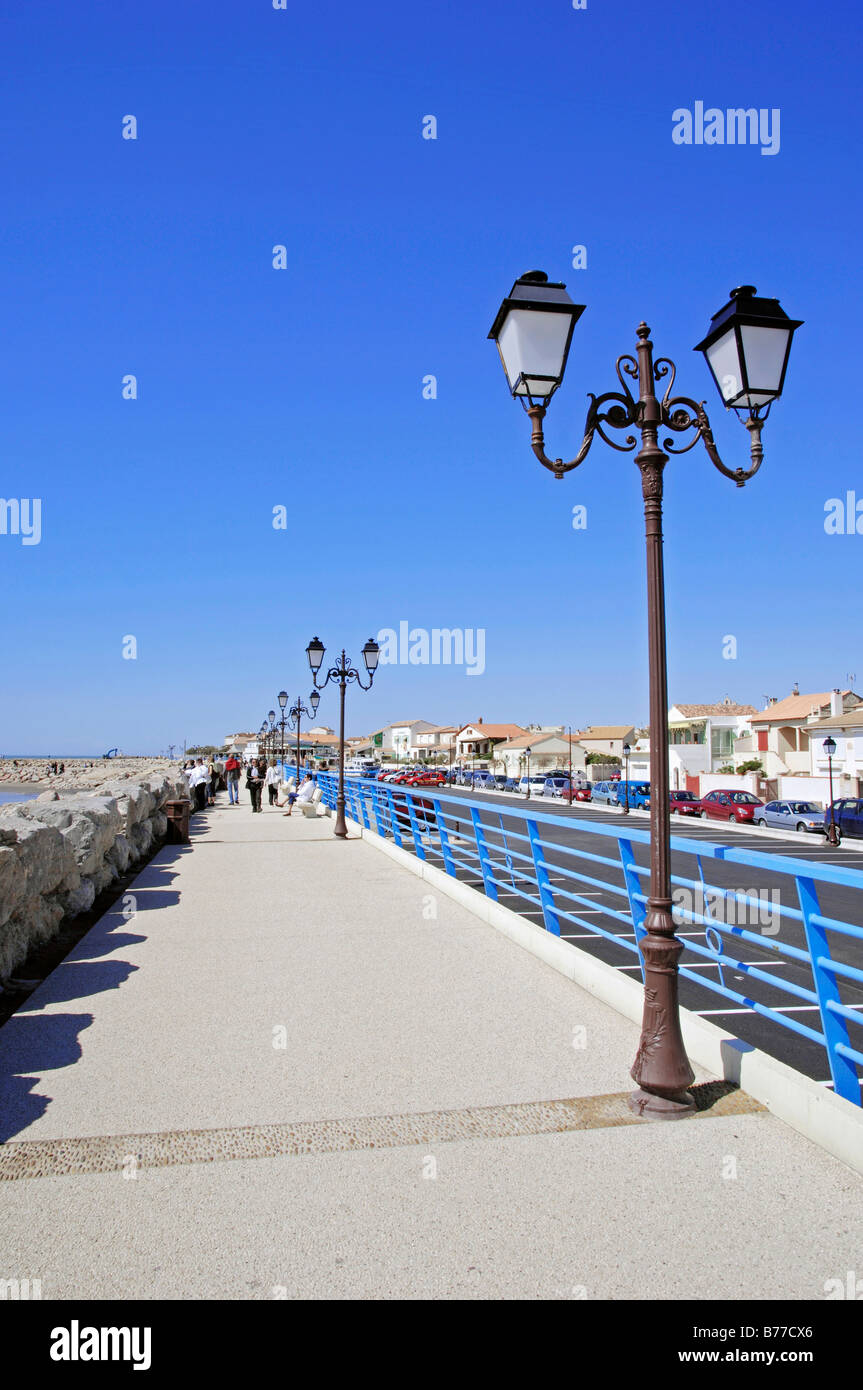 Seafront promenade with lanterns, Les Saintes-Maries-de-la-Mer, Camargue, Bouches-du-Rhone, Provence-Alpes-Cote d'Azur, Souther Stock Photo