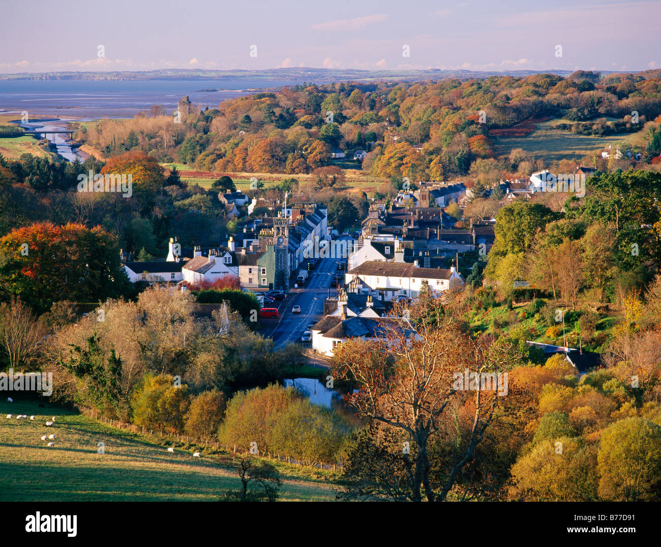 Scenic autumn landscape looking down on town of Gatehouse of Fleet amoungest the trees Galloway Scotland UK Stock Photo
