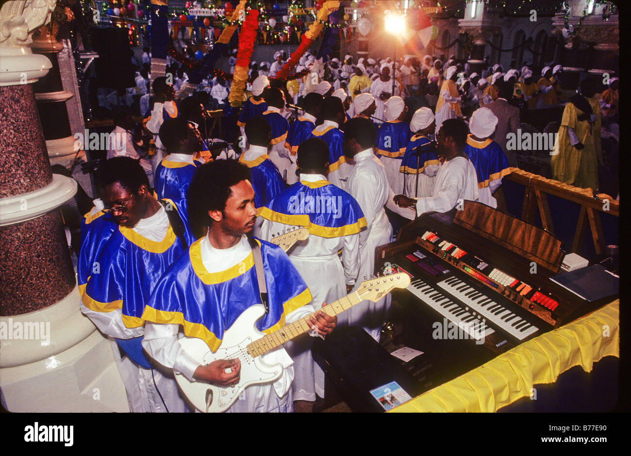 Members of the Celestial Church Of Christ play guitar during a harvest festival celebration. Stock Photo