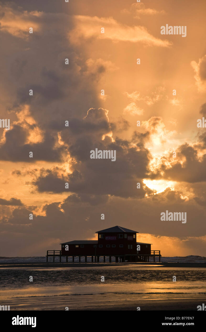 Restaurant Strandbar at sunset, built on stilts off the St. Peter-Ording beach, Eiderstedt Peninsula, Schleswig-Holstein, Germa Stock Photo