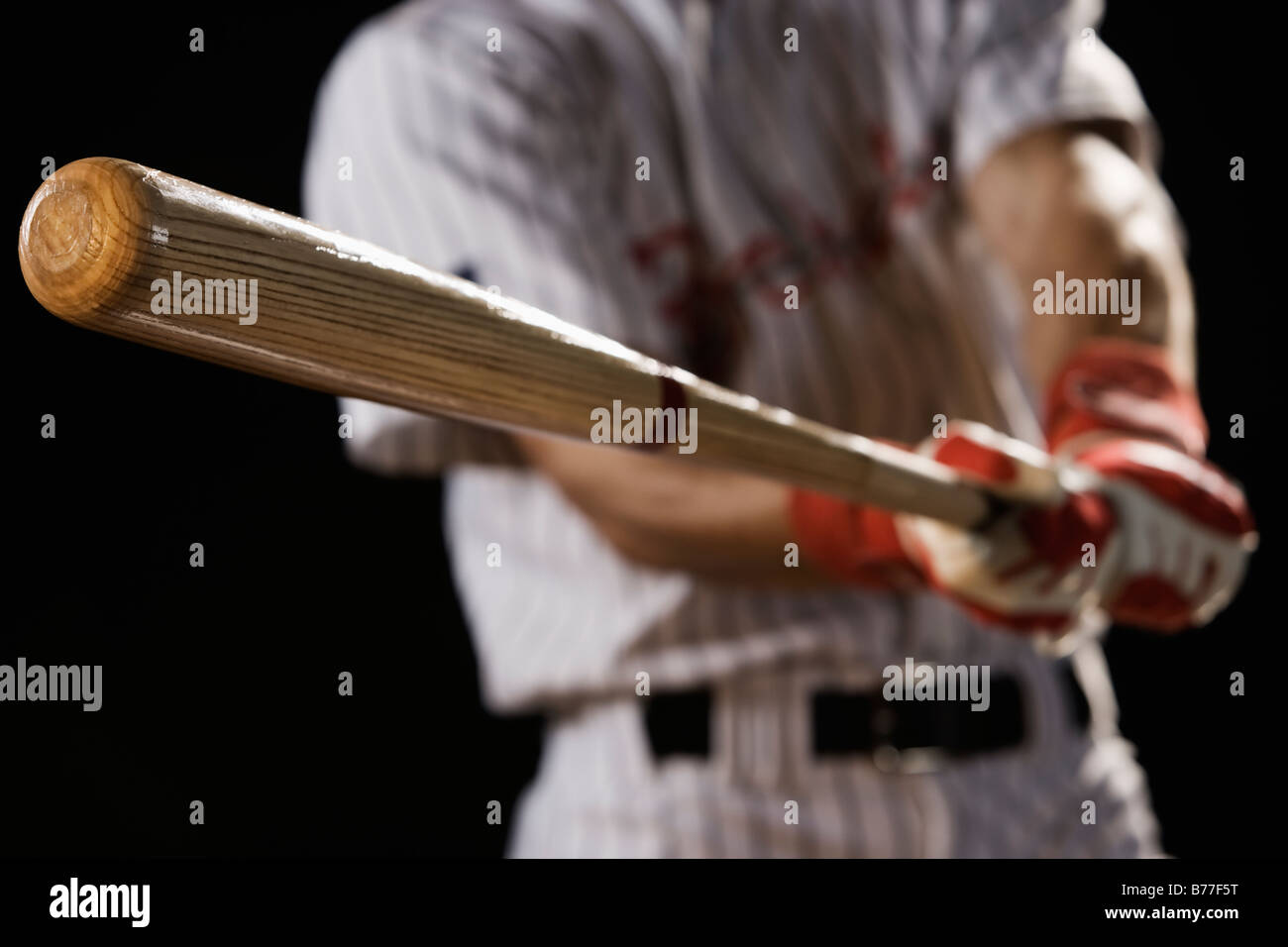 Close up of baseball player swinging bat Stock Photo Alamy