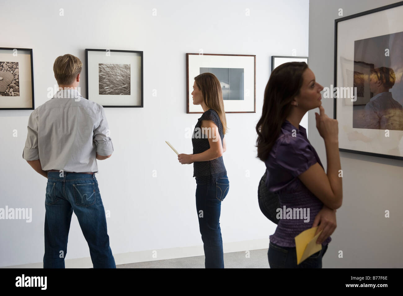 Woman inside looking art gallery hires stock photography and images