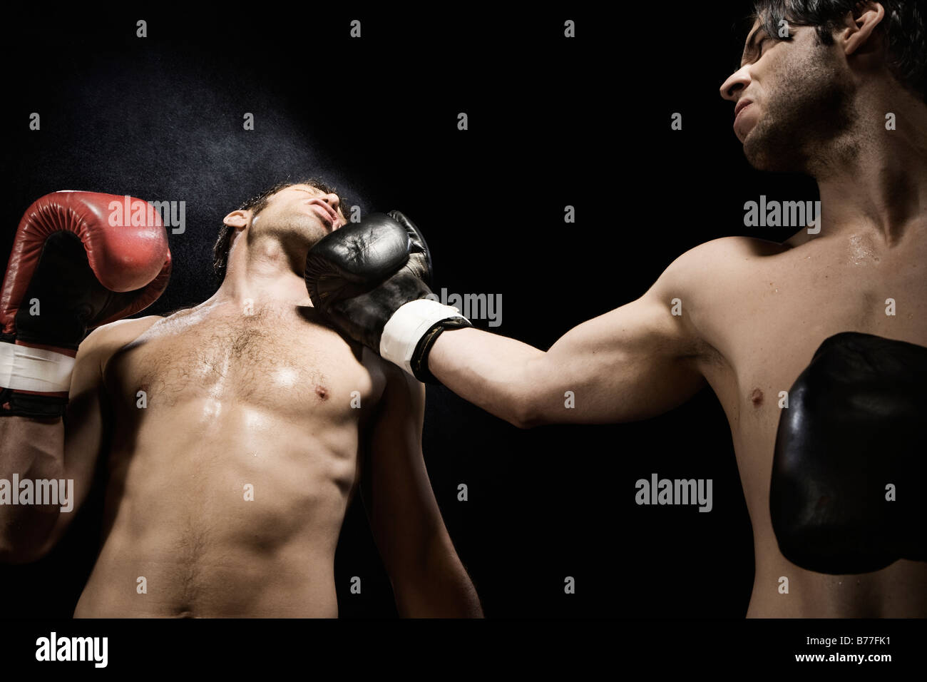 Boxer punching opponent jaw Stock Photo Alamy