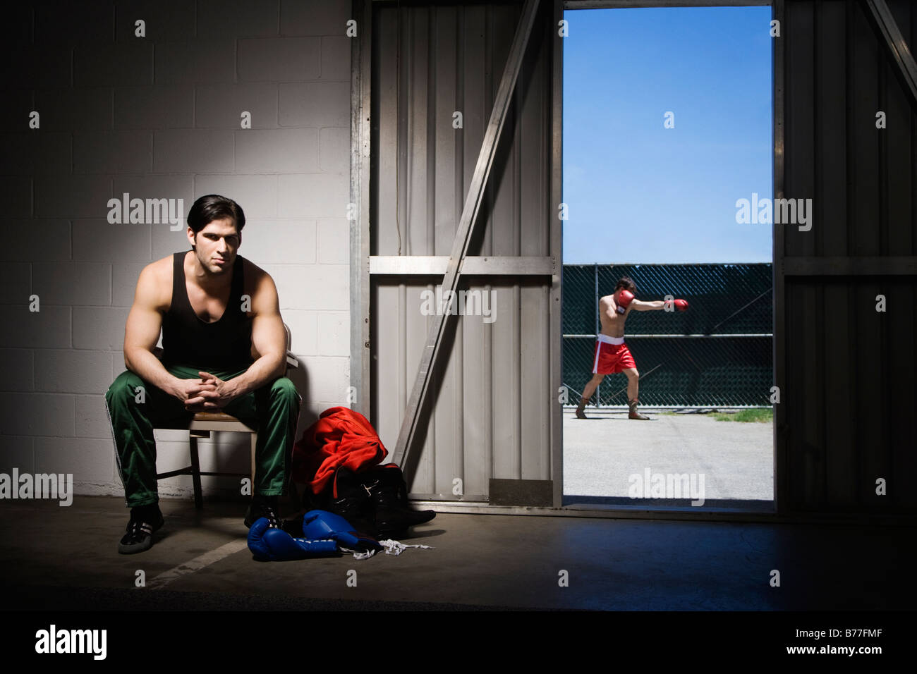 Man sitting on stool hi-res stock photography and images - Alamy