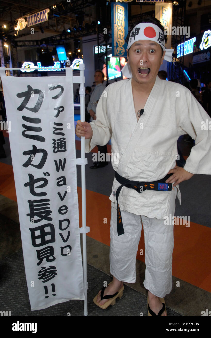 Man dressed in martial arts gear advertising a Japanese magazine for console game players  at the Tokyo Game Show 2008, Tokyo. Stock Photo