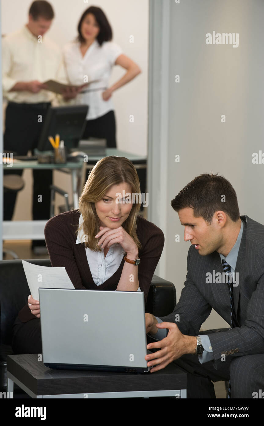 Using Computer With Partner Business partner using laptop hi-res stock photography and images - Alamy