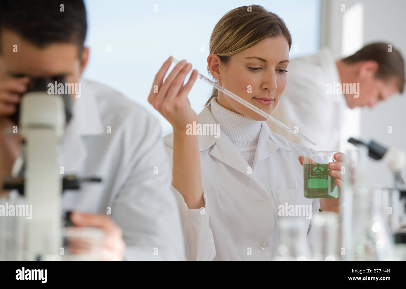 Scientists experimenting pharmaceutical laboratory Stock Photo