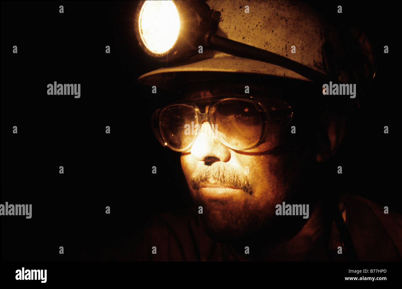 'Shirebrook, Nottinghamshire, UK A close-up view of a miner underground in the colliery. Stock Photo