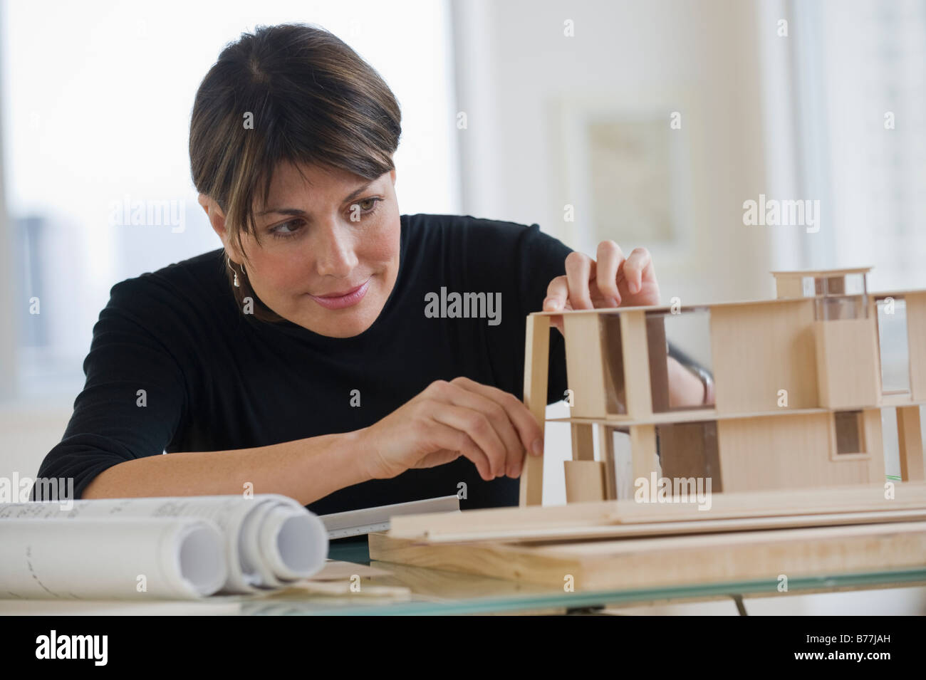 Architect constructing building model Stock Photo Alamy