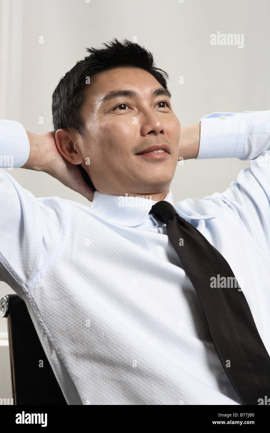 Resting In Chair Businessman resting in chair Stock Photo - Alamy