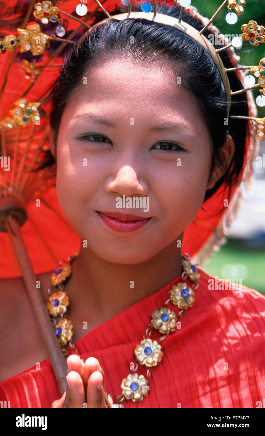 Young Thai girl in traditional dress in front of the Hindu-Buddist Monastery Wat Arun in Bangkok, Thailand, Asia Stock Photo