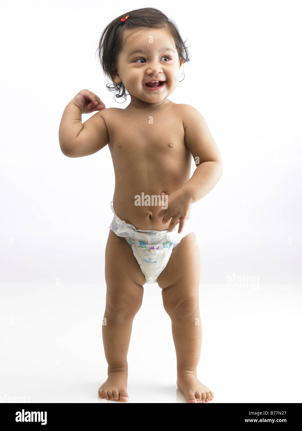 Indian baby girl wearing diaper MR#702O Stock Photo - Alamy